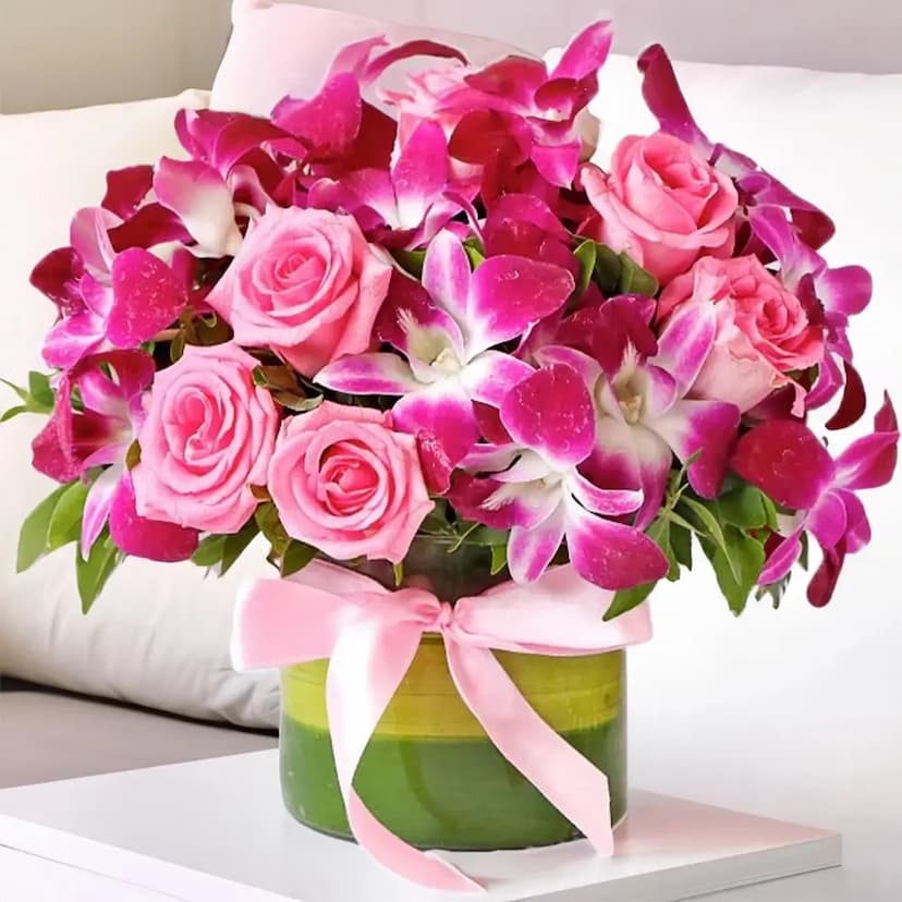 10 purple orchids and 10 pink roses in a vase