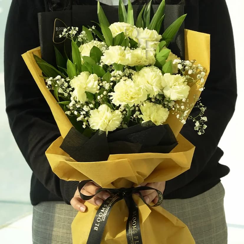 12 yellow carnations in a bouquet