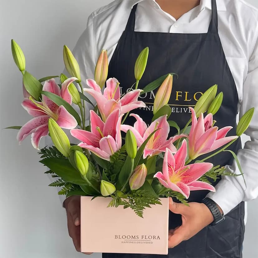 5 pink lilies in a pink box