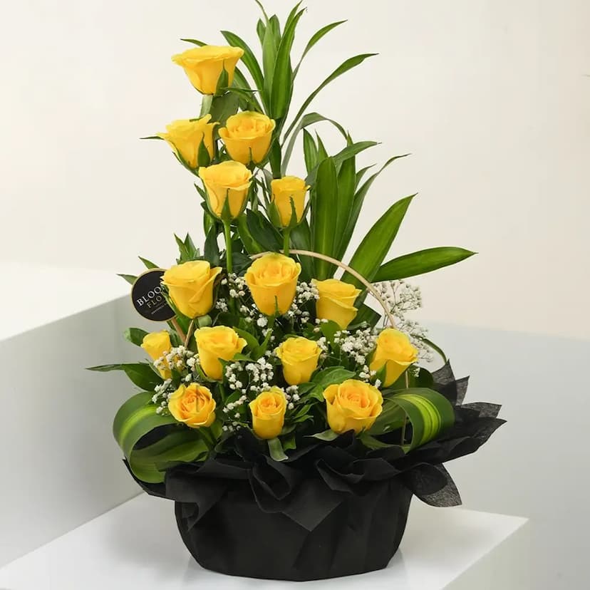 15 yellow roses in a basket