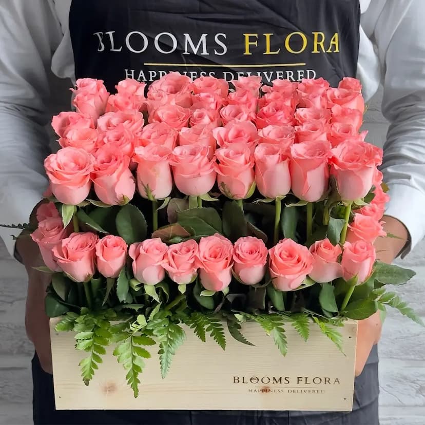 70 baby pink roses in a wooden box