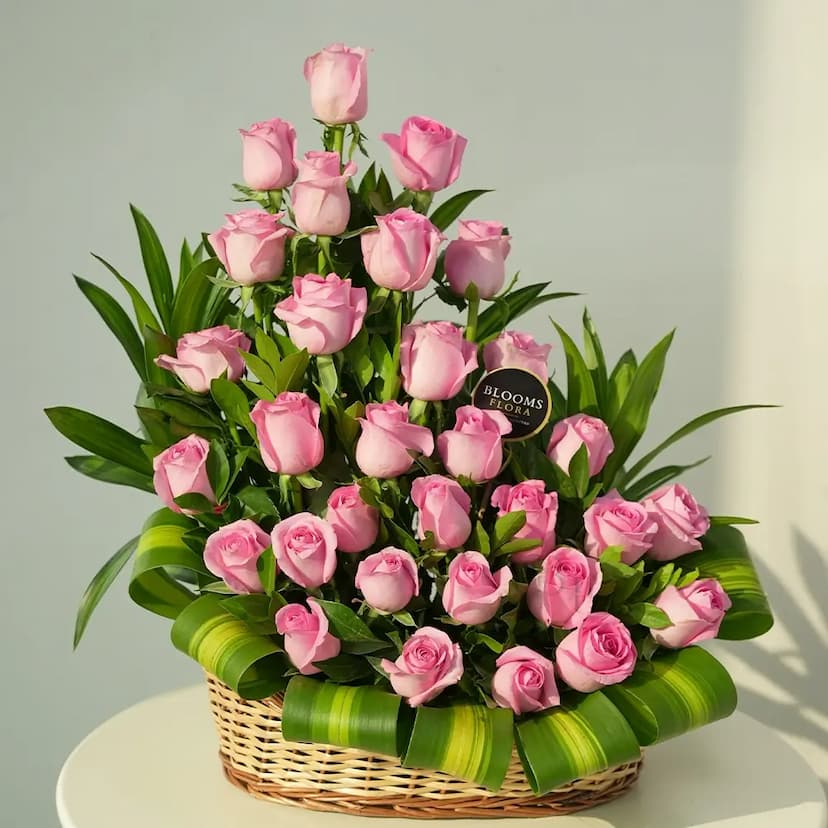 30 pink roses in a basket