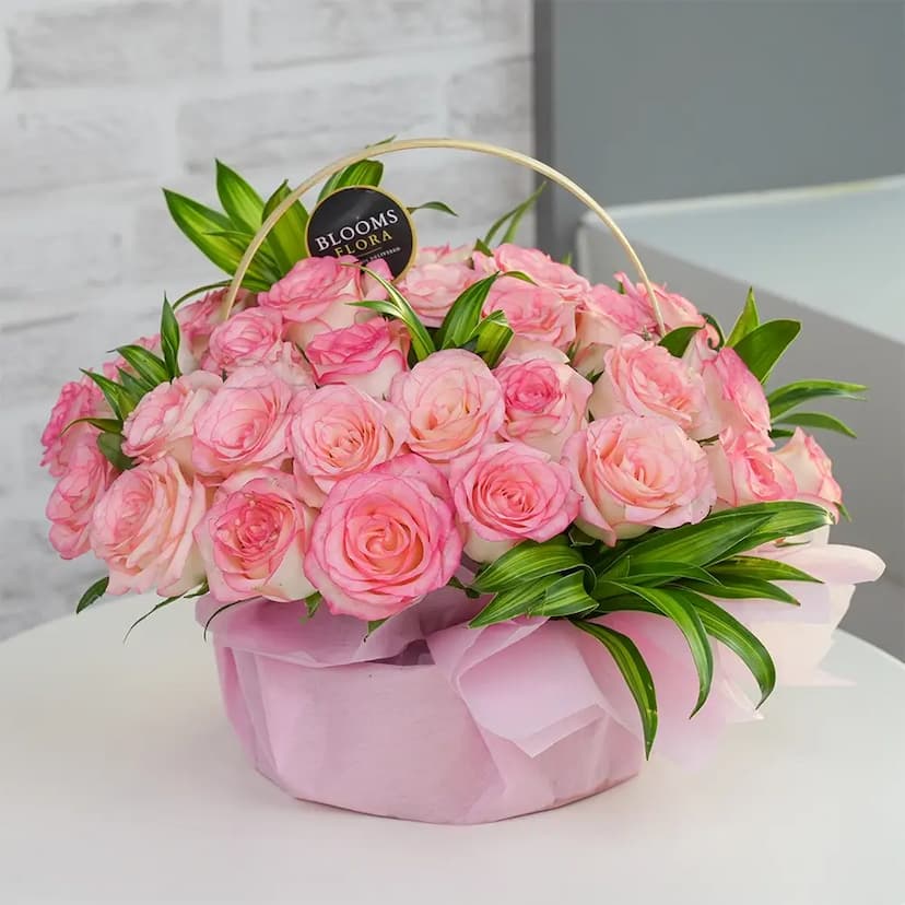 30 pink roses in a basket