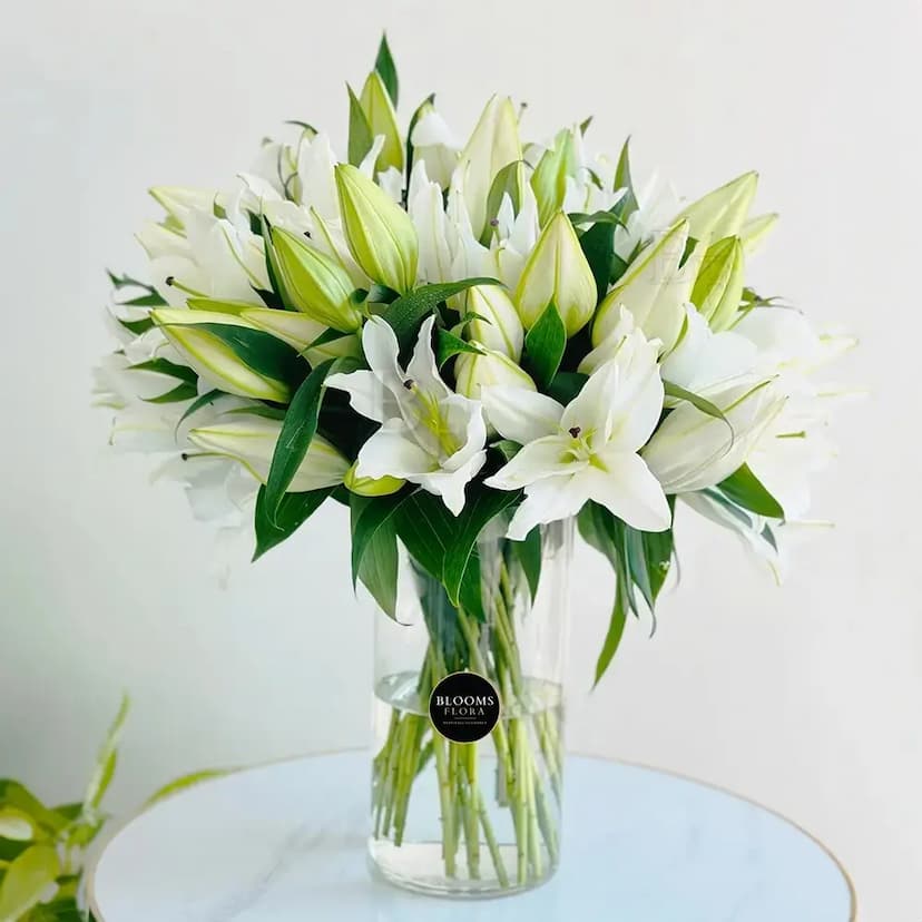 glass vase of 20 white lilies