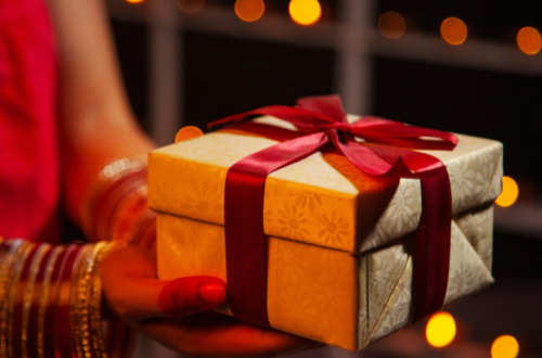 A woman holding a gift box